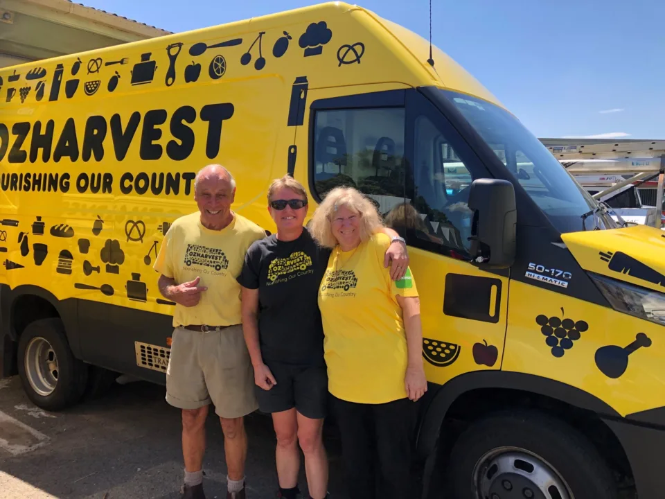 Three Sunshine Coast Volunteers standing out the front of OzHarvest van