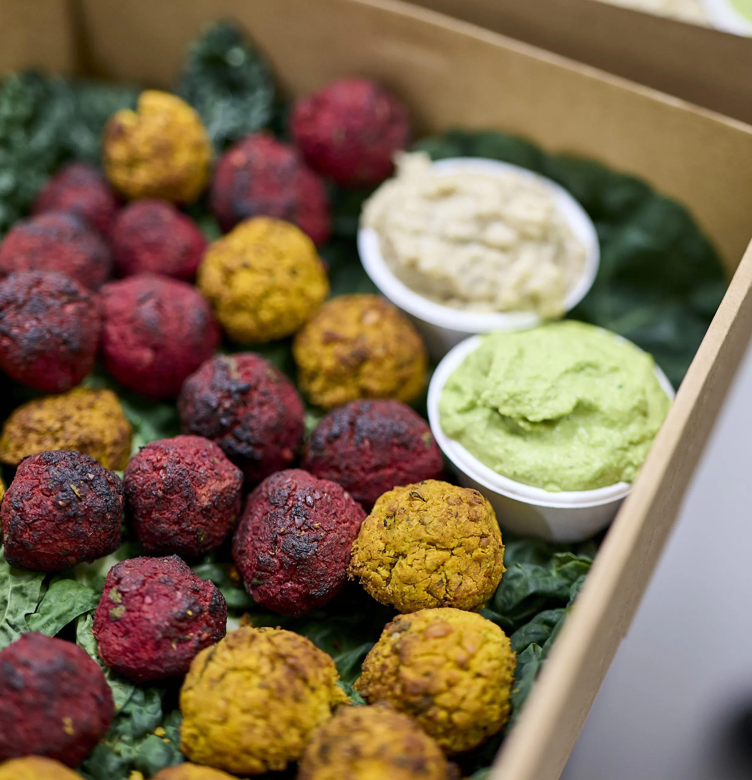 Rainbow falafel bites prepared by OzHarvest Catering.